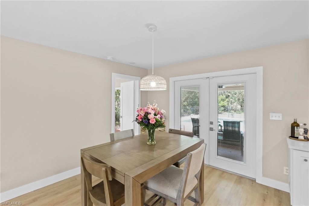 3221 68th Street Southwest Naples, FL 34105 - Photo 9 of 38 a view of a dining room with furniture window and outside view