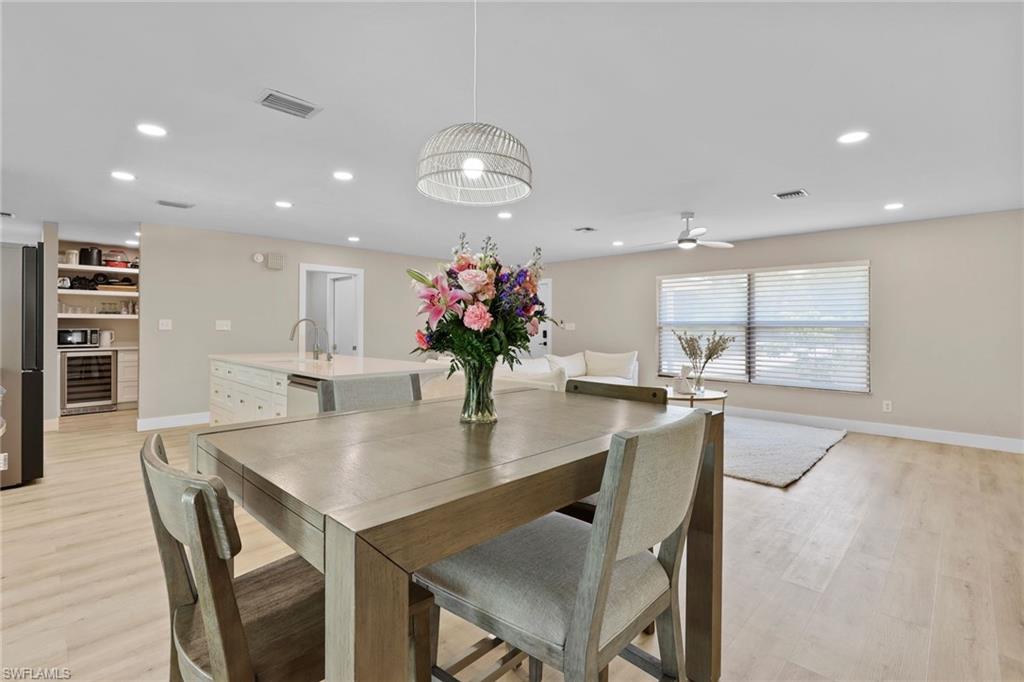 3221 68th Street Southwest Naples, FL 34105 - Photo 10 of 38 a dining room with furniture and window