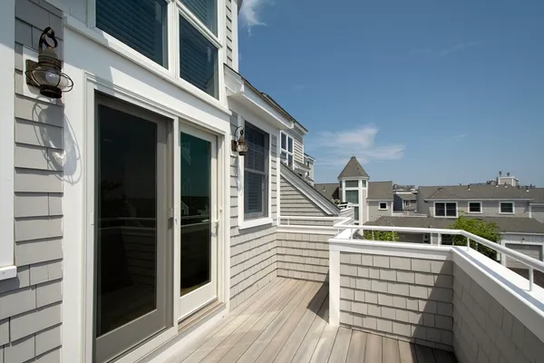 a view of entryway with wooden floor and windows