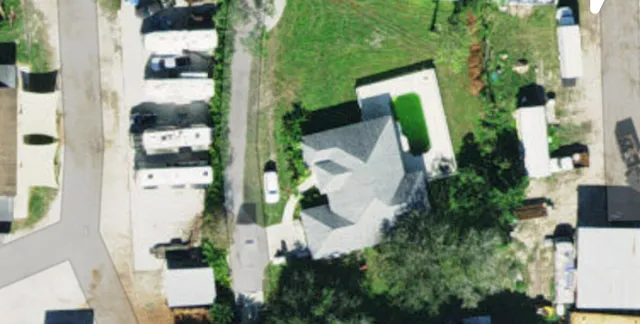 an aerial view of a house with a garden