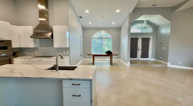 a kitchen with counter top space cabinets and appliances