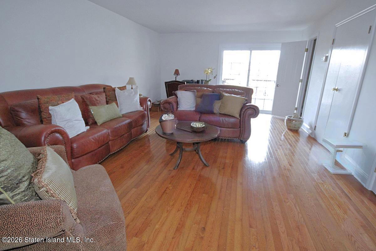 951 West Fingerboard Road Staten Island, NY 10304 - Photo 21 of 29 a living room with furniture and wooden floor