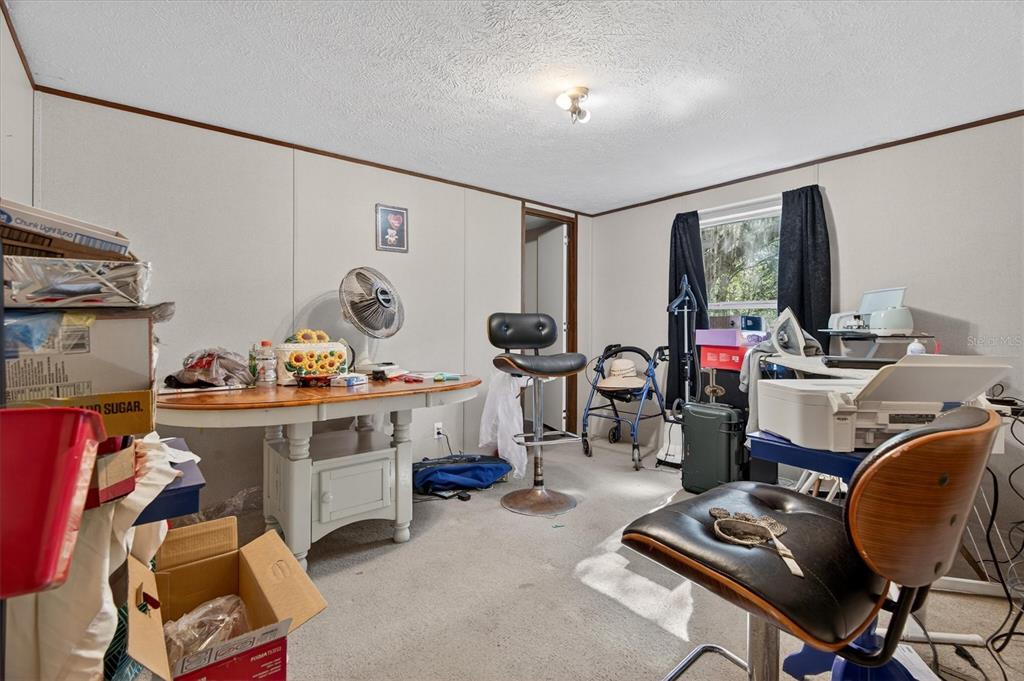 5083 Southeast 70th Loop Ocala, FL 34480 - Photo 15 of 34 a view of a room with workspace and a window