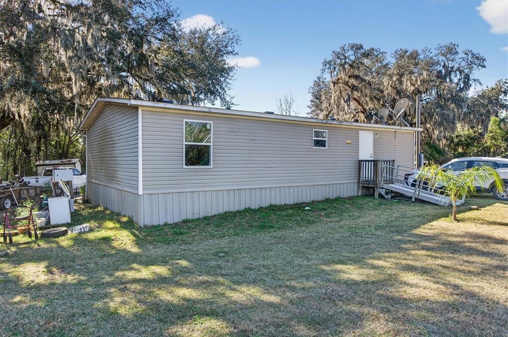 5083 Southeast 70th Loop Ocala, FL 34480 - Photo 22 of 34 a view of backyard of house