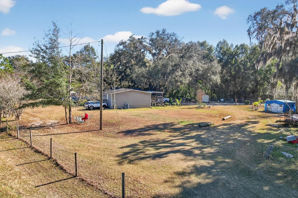 5083 Southeast 70th Loop Ocala, FL 34480 - Photo 24 of 34 a view of swimming pool with an outdoor seating