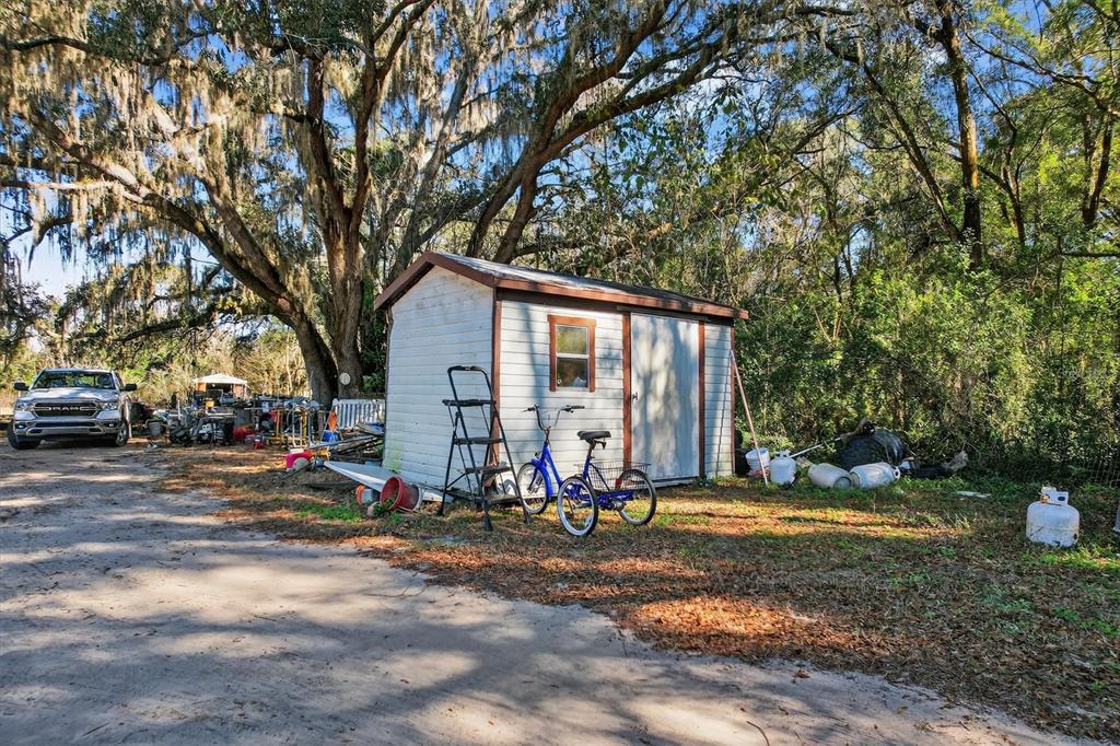 5083 Southeast 70th Loop Ocala, FL 34480 - Photo 29 of 34 a view of a house with backyard space and sitting area