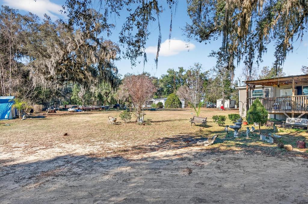 5083 Southeast 70th Loop Ocala, FL 34480 - Photo 30 of 34 a view of yard with trees