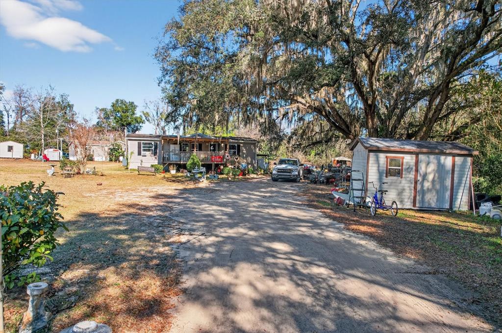 5083 Southeast 70th Loop Ocala, FL 34480 - Photo 5 of 34 a city view with tall buildings and cars parked in front of it