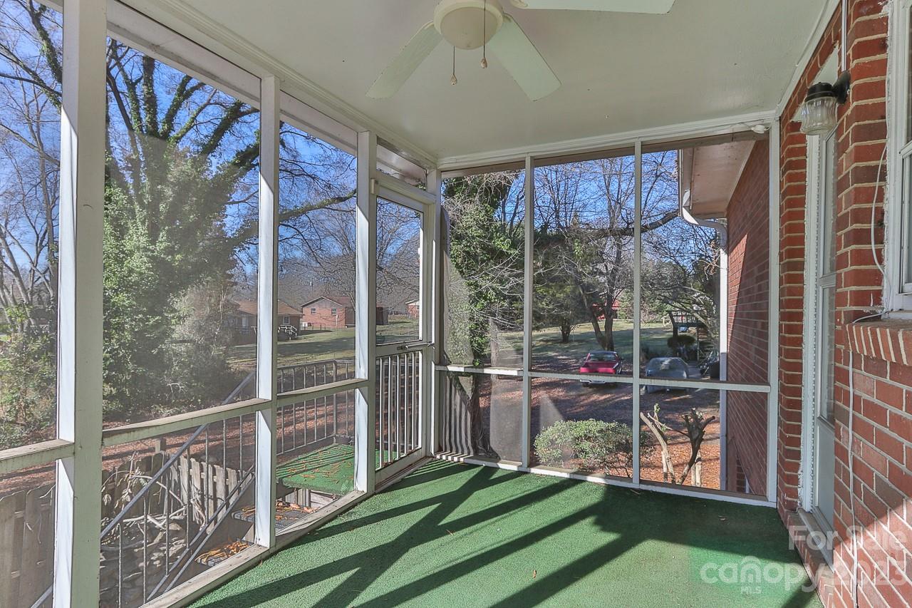 4081 Section House Road Hickory, NC 28601 - Photo 15 of 48 a view of a porch with a floor to ceiling window