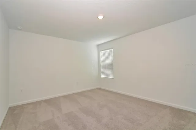 an empty room with a empty space and window