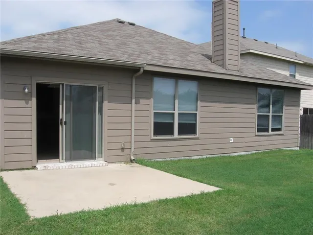 a kitchen with a stove top oven microwave and cabinets