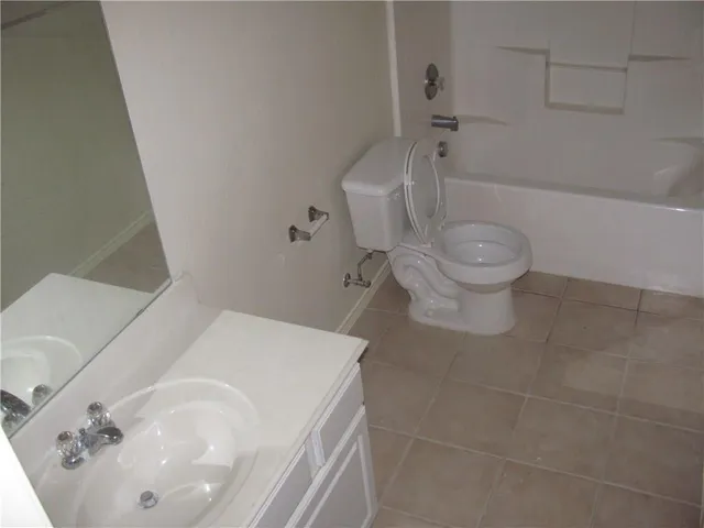 a bathroom with a sink and shower