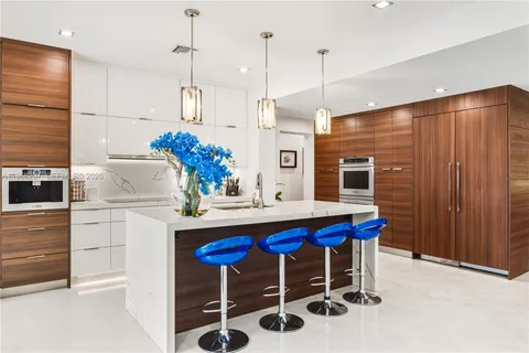 a view of a patio with swimming pool table and chairs