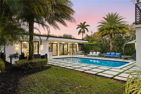 a view of a patio with swimming pool table and chairs