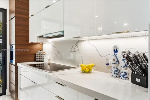 a bathroom with a shower and a sink