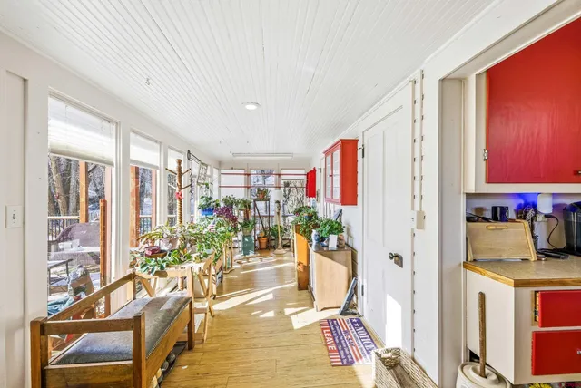 a bed room with a bed and a chandelier