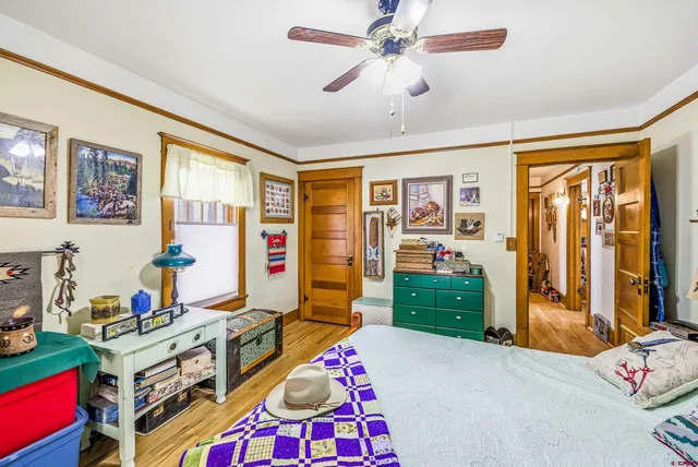 a room with furniture gym equipment and a flat screen tv