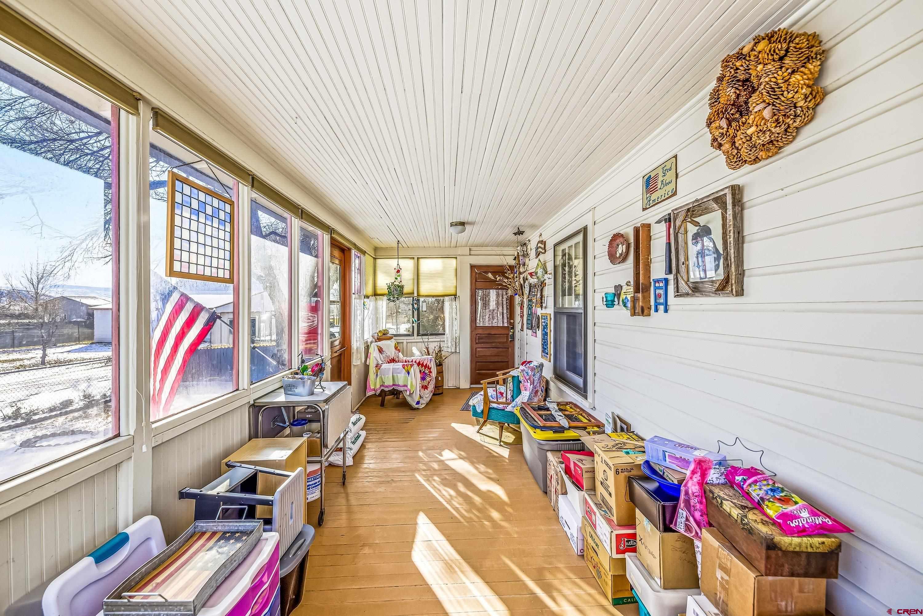 21568 Austin Road Austin, CO 81410 - Photo 5 of 37 a very nice looking room with many windows and furniture