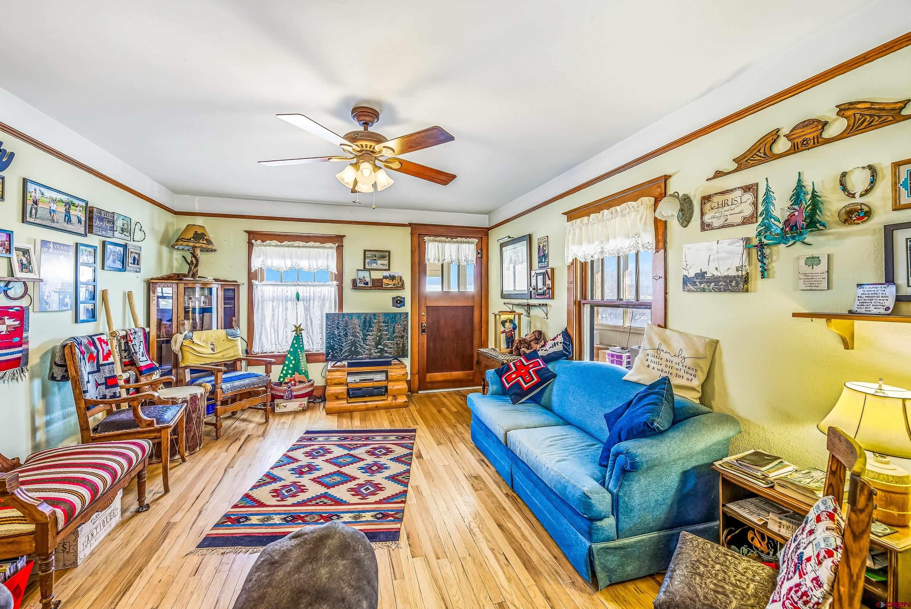 21568 Austin Road Austin, CO 81410 - Photo 6 of 37 a living room with furniture fireplace and a large window