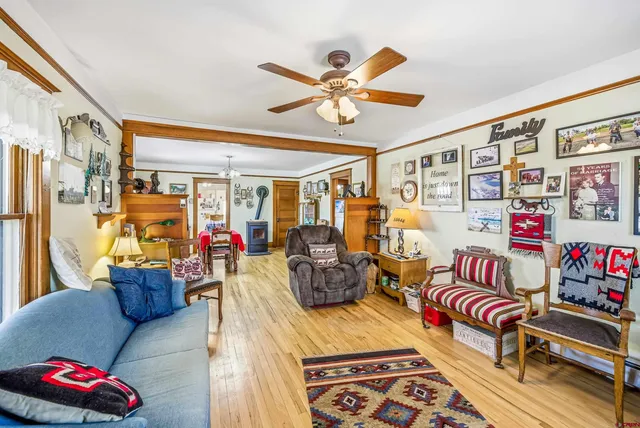 a living room with furniture and a chandelier