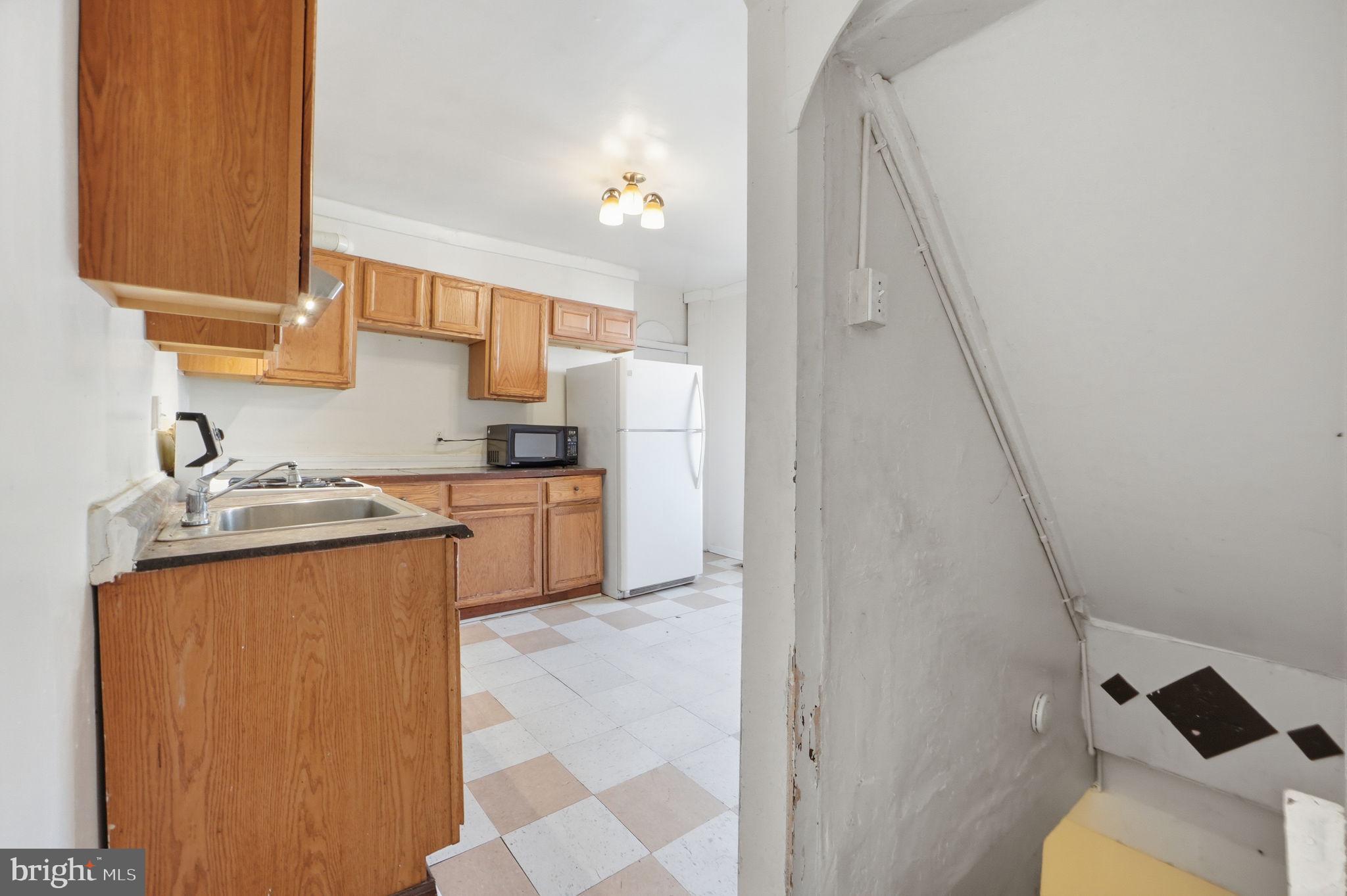 3449 Old Frederick Road Baltimore, MD 21229 - Photo 4 of 25 Cozy kitchen with warm wood accents.