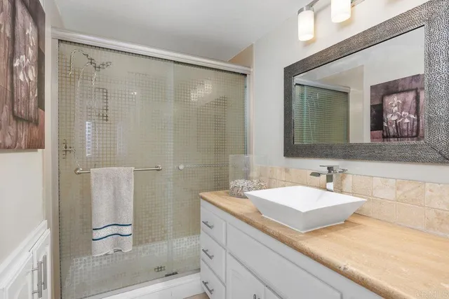 a bathroom with a double vanity sink mirror and double