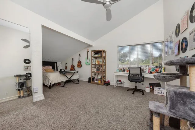a living room with furniture and a gym equipment