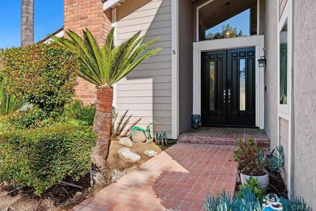 a view of a potted plants in front of a house