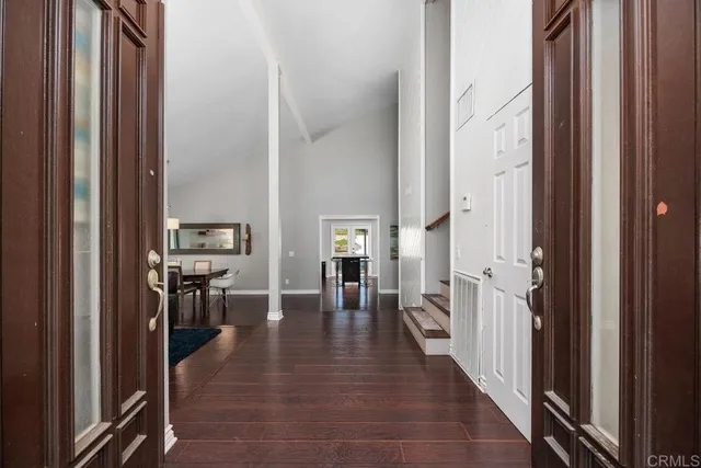 a hall way with furniture and wooden floor