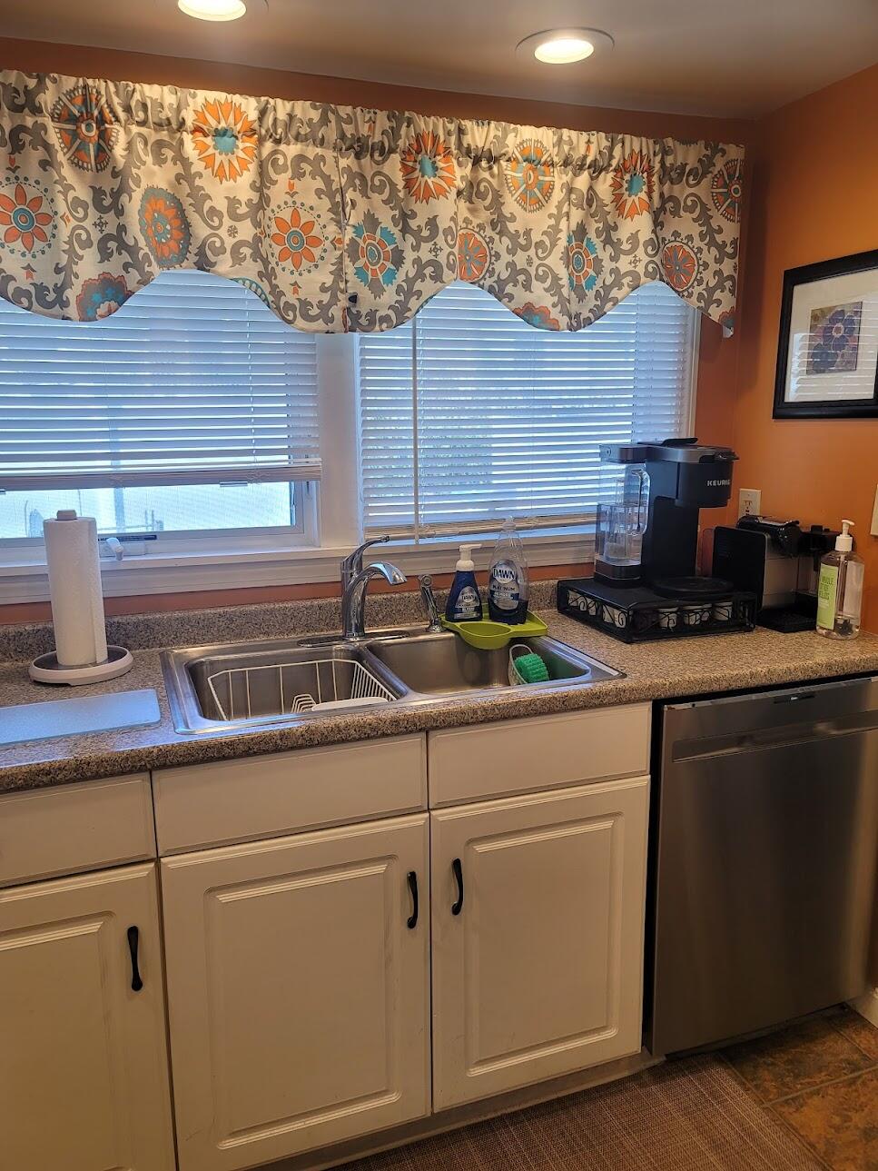95 Spring Street Hyannis, MA 02601 - Photo 11 of 38 a kitchen with a cabinets and a stove
