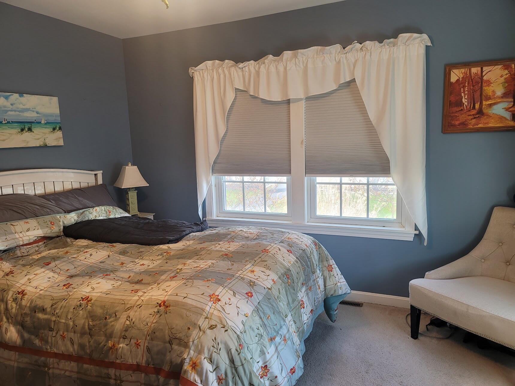 95 Spring Street Hyannis, MA 02601 - Photo 16 of 38 a bedroom with a bed chair and window