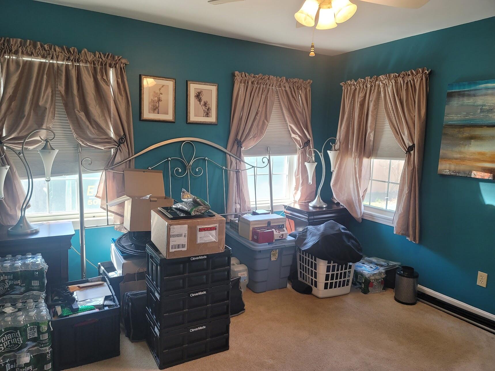 95 Spring Street Hyannis, MA 02601 - Photo 19 of 38 a living room with furniture a bed and a chandelier