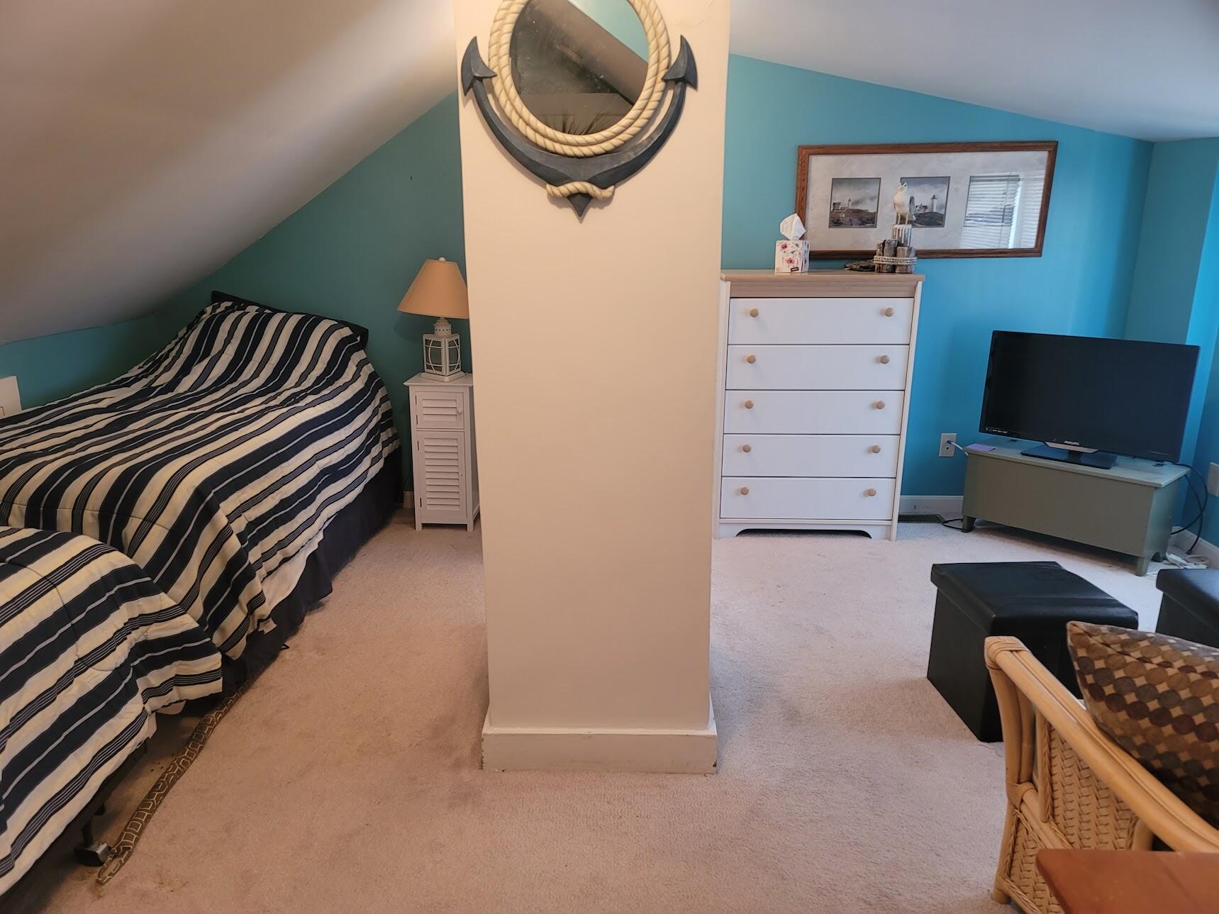 95 Spring Street Hyannis, MA 02601 - Photo 22 of 38 a bedroom with a bed and a flat screen tv