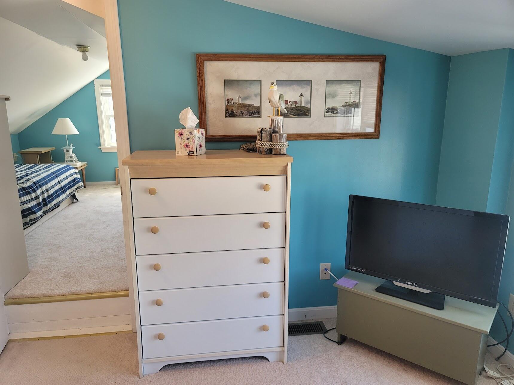 95 Spring Street Hyannis, MA 02601 - Photo 24 of 38 a living room with furniture and a flat screen tv