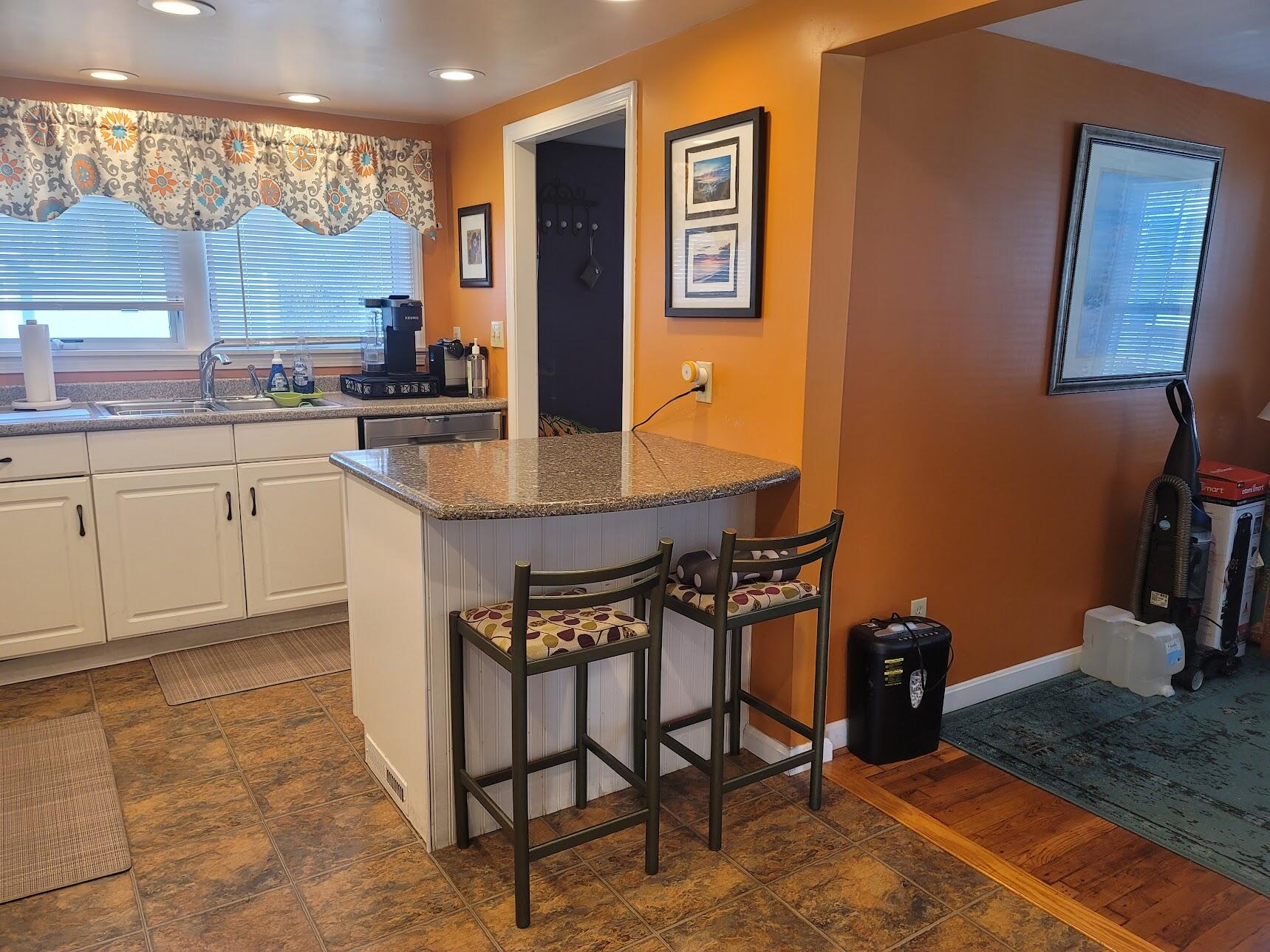 95 Spring Street Hyannis, MA 02601 - Photo 6 of 38 a kitchen with stainless steel appliances granite countertop a sink and cabinets
