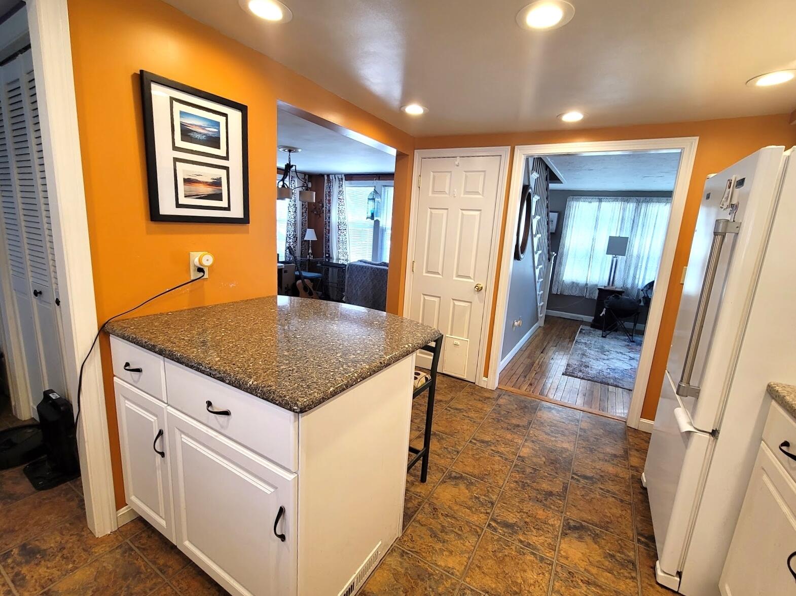 95 Spring Street Hyannis, MA 02601 - Photo 9 of 38 a kitchen with stainless steel appliances granite countertop a refrigerator and a stove