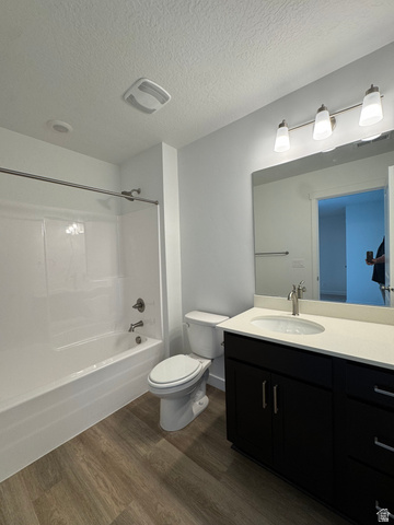 1476 North 1875 West, Unit 152 Layton, UT 84041 - Photo 13 of 20 Contemporary bathroom featuring a dark wood-finish vanity with a light countertop, a rectangular mirror, and a white tub/shower combination