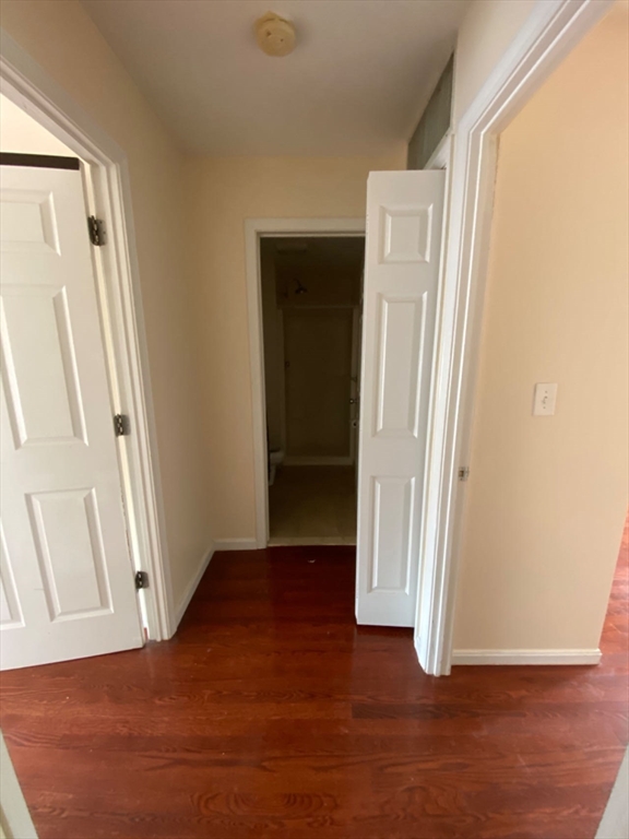 22 Chestnut Street, Unit 22 Cambridge, MA 02139 - Photo 13 of 18 an empty room with wooden floor and closet