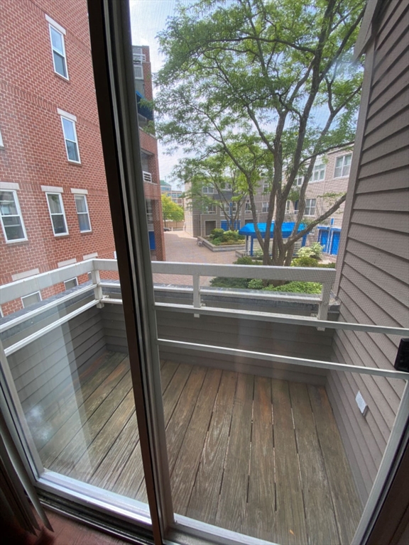 22 Chestnut Street, Unit 22 Cambridge, MA 02139 - Photo 9 of 18 a view of backyard from window