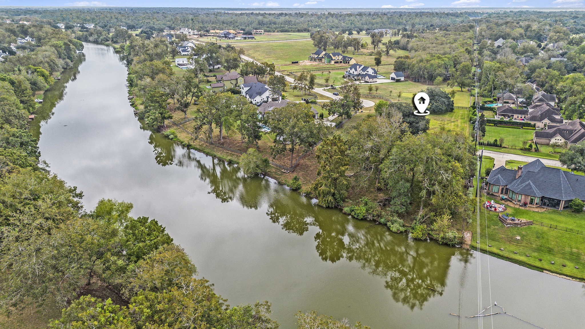 30703 Riverlake Road Fulshear, TX 77441 - Photo 11 of 13 a view of a lake with a mountain view