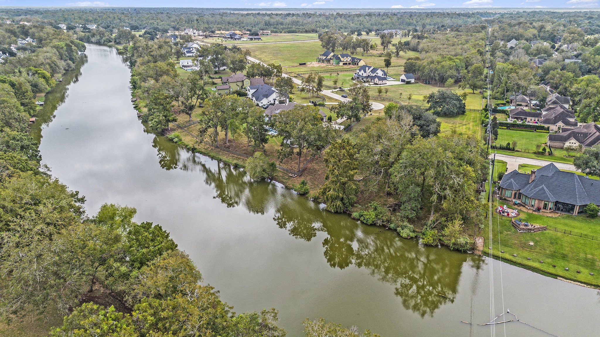 30703 Riverlake Road Fulshear, TX 77441 - Photo 2 of 13 a view of a lake with a mountain view