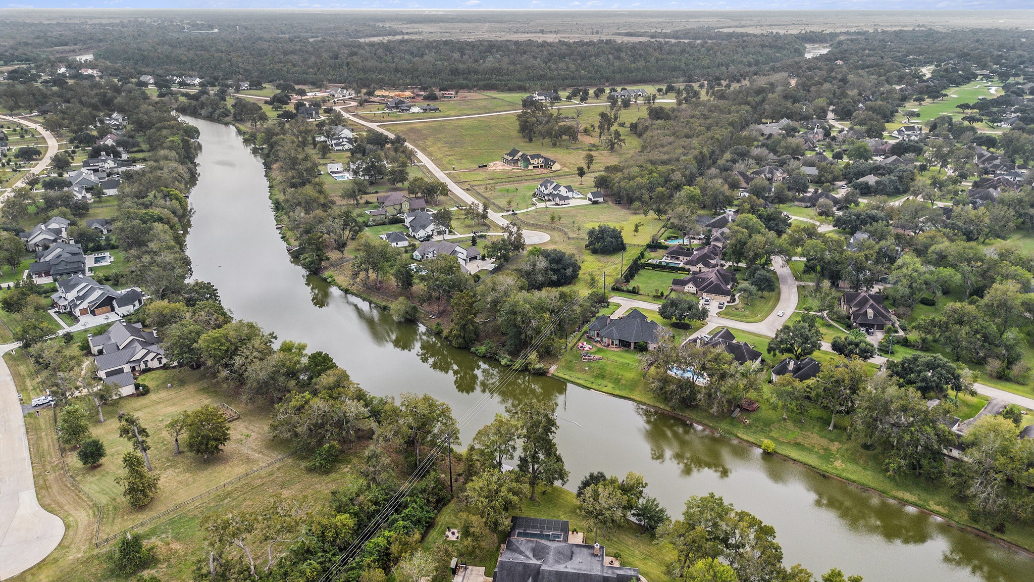 30703 Riverlake Road Fulshear, TX 77441 - Photo 4 of 13 a view of a lake with a city