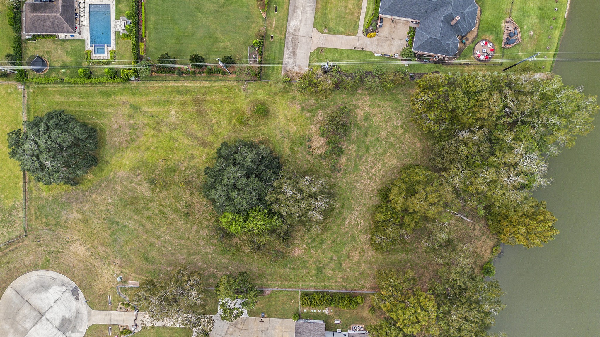 30703 Riverlake Road Fulshear, TX 77441 - Photo 6 of 13 a view of a yard with an outdoor space