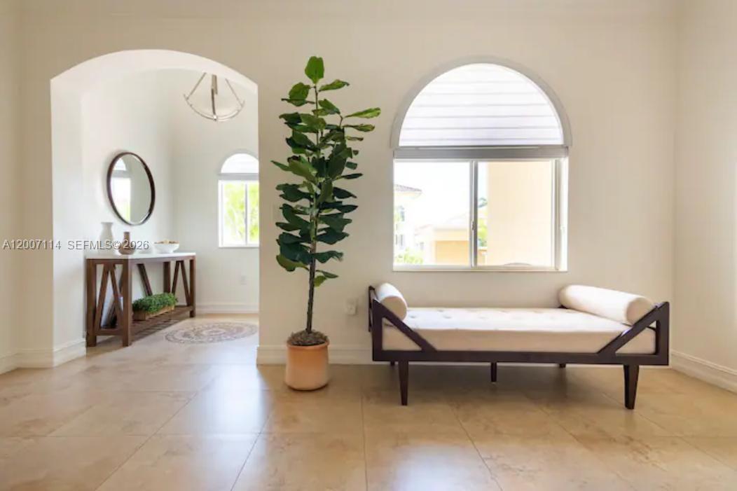15566 Southwest 13th Terrace Miami, FL 33194 - Photo 11 of 27 a living room with furniture and a window