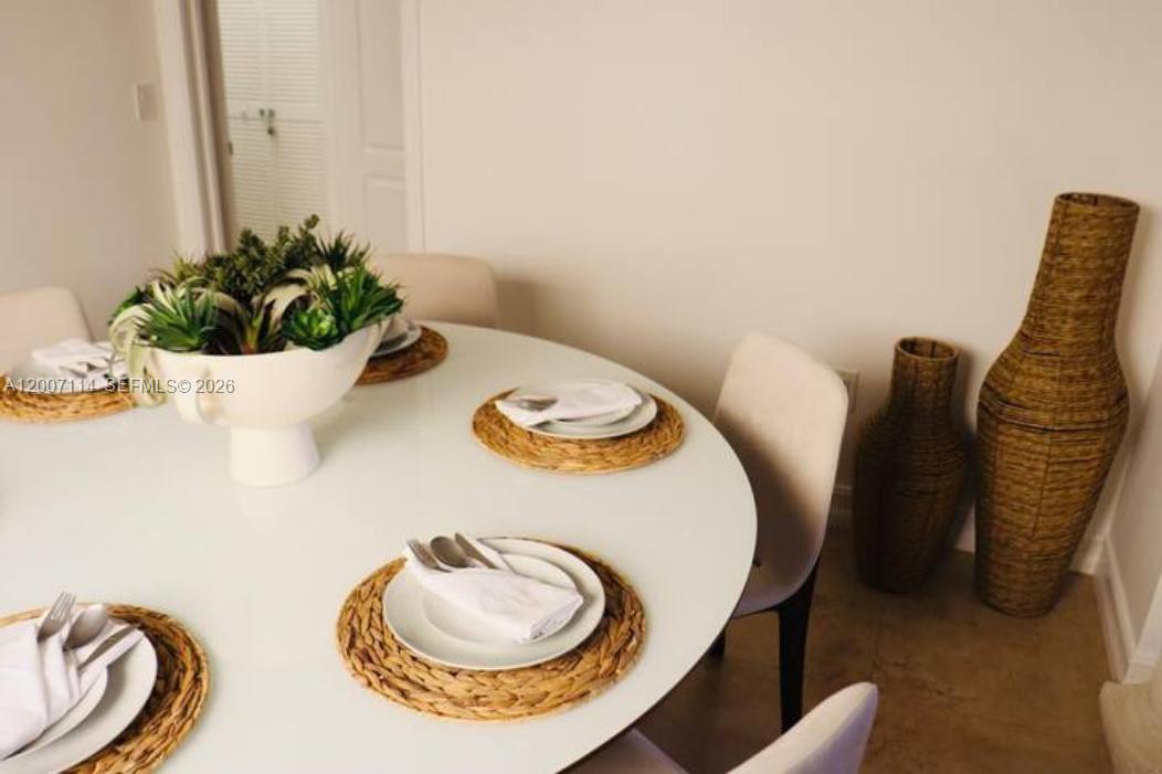 15566 Southwest 13th Terrace Miami, FL 33194 - Photo 12 of 27 a close view of dining table with chairs