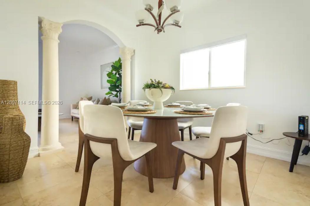 15566 Southwest 13th Terrace Miami, FL 33194 - Photo 13 of 27 a view of a dining room with furniture