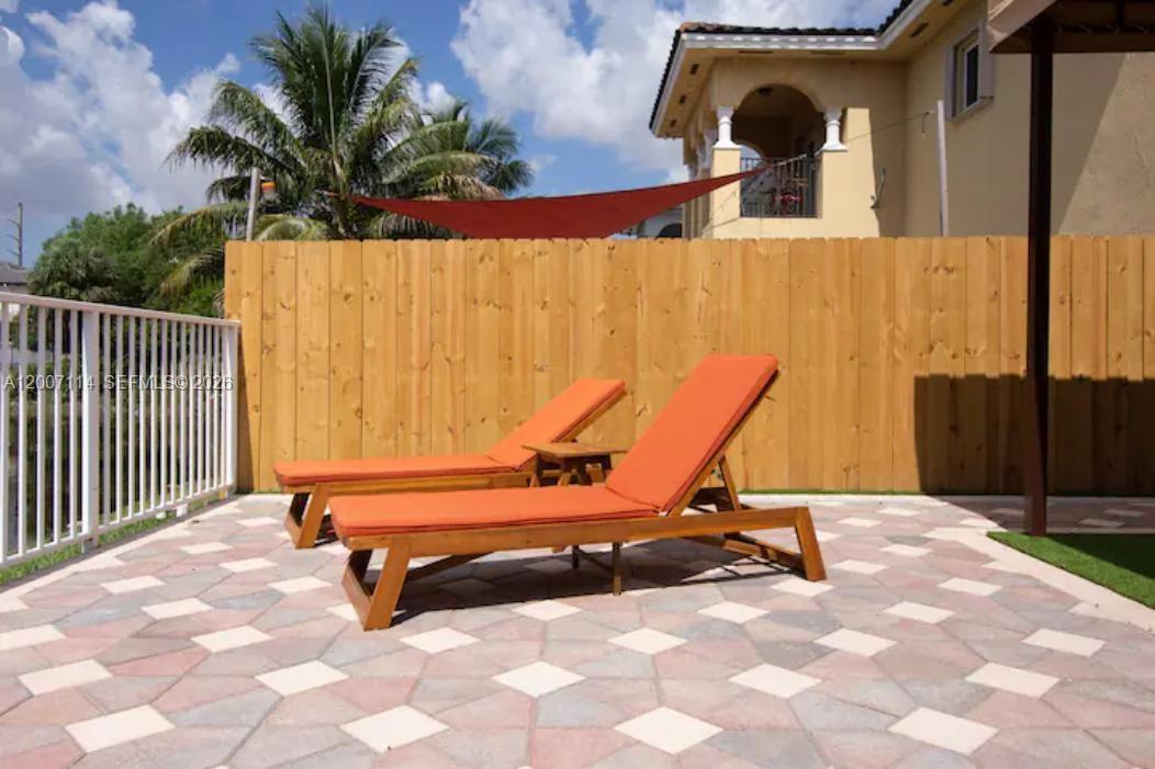 15566 Southwest 13th Terrace Miami, FL 33194 - Photo 22 of 27 a view of a bench in a patio