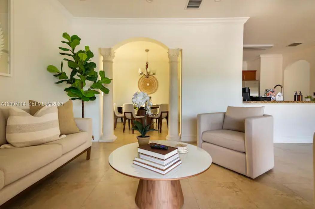 15566 Southwest 13th Terrace Miami, FL 33194 - Photo 8 of 27 a living room with furniture and a potted plant