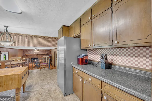 a kitchen with a window a sink and a counter top space