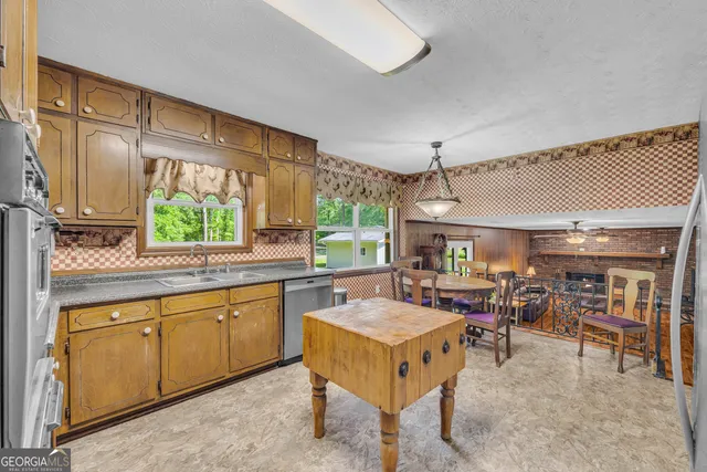 a view of a dining room with furniture window and outside view
